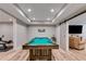 Finished basement featuring pool table and exercise equipment with view into a lounge area at 5473 Heatherbrooke Nw Dr, Acworth, GA 30101