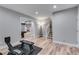 Finished basement showcasing exercise equipment with view to the pool table and staircase at 5473 Heatherbrooke Nw Dr, Acworth, GA 30101