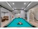 Finished basement game room with pool table, sliding barn door, and comfortable seating at 5473 Heatherbrooke Nw Dr, Acworth, GA 30101