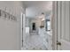 Spacious bathroom featuring stylish tile floors, double vanity, tub shower, and decorative wall hooks at 5473 Heatherbrooke Nw Dr, Acworth, GA 30101