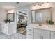 Bright bathroom with dual vanities, decorative tile floor, and open view to bedroom at 5473 Heatherbrooke Nw Dr, Acworth, GA 30101