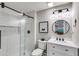 Modern bathroom with a glass-enclosed shower, vanity, and sleek fixtures at 5473 Heatherbrooke Nw Dr, Acworth, GA 30101