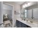 Bright bathroom with dual sinks, quartz countertops, and ample storage at 5473 Heatherbrooke Nw Dr, Acworth, GA 30101
