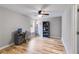 Bedroom with light gray walls, wood-look floors, and a ceiling fan at 5473 Heatherbrooke Nw Dr, Acworth, GA 30101