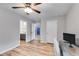 Bedroom with wood-look floors featuring doorways and a ceiling fan at 5473 Heatherbrooke Nw Dr, Acworth, GA 30101