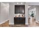 Custom built-in cabinet with dark wood finish, white countertop, and backsplash, seamlessly integrated into the home's design at 5473 Heatherbrooke Nw Dr, Acworth, GA 30101