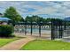 Community pool with lounge chairs and shade umbrellas at 5473 Heatherbrooke Nw Dr, Acworth, GA 30101
