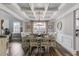 Elegant dining room with coffered ceiling, wood floors, and a stylish light fixture at 5473 Heatherbrooke Nw Dr, Acworth, GA 30101
