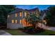 An exterior elevation showcasing a two-story home with a well-manicured lawn and two-car garage at 5473 Heatherbrooke Nw Dr, Acworth, GA 30101