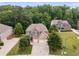 An exterior elevation showcasing a two-story home with a well-manicured lawn and two-car garage at 5473 Heatherbrooke Nw Dr, Acworth, GA 30101
