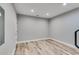 Finished room showcasing recessed lights and durable wood flooring at 5473 Heatherbrooke Nw Dr, Acworth, GA 30101
