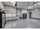 Spacious garage featuring custom cabinets, countertops, epoxy flooring and storage at 5473 Heatherbrooke Nw Dr, Acworth, GA 30101