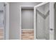Bright hallway with wood flooring and an open doorway at 5473 Heatherbrooke Nw Dr, Acworth, GA 30101