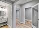 Hallway with a bathroom, bedroom, and bonus room leading off it at 5473 Heatherbrooke Nw Dr, Acworth, GA 30101