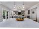 Well-appointed kitchen with an island, modern lighting, and seamless flow to the living area at 5473 Heatherbrooke Nw Dr, Acworth, GA 30101