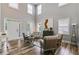 Bright living room with high ceilings, beautiful wood floors, and an abundance of natural light at 5473 Heatherbrooke Nw Dr, Acworth, GA 30101