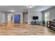 Spacious living room features wood floors, neutral walls, and ample natural light at 5473 Heatherbrooke Nw Dr, Acworth, GA 30101