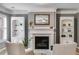 Living room featuring fireplace, built-ins, and chair at 5473 Heatherbrooke Nw Dr, Acworth, GA 30101