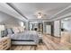 Main bedroom with fireplace, built-ins, and tray ceiling at 5473 Heatherbrooke Nw Dr, Acworth, GA 30101