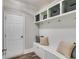 Organized mudroom with built-in bench seating, storage cabinets, hooks, and shelving offering a practical entry space at 5473 Heatherbrooke Nw Dr, Acworth, GA 30101