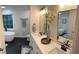 Modern bathroom with double vanity, soaking tub, black fixtures and gray walls at 6070 Lively Ct, Cumming, GA 30040