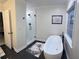 Bright bathroom with a soaking tub, walk-in shower with glass door, and black fixtures at 6070 Lively Ct, Cumming, GA 30040