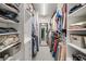 Organized walk-in closet with ample shelving and storage for clothing and accessories at 6070 Lively Ct, Cumming, GA 30040