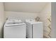 Laundry room with Samsung washer and dryer units, and a drying rack at 6070 Lively Ct, Cumming, GA 30040
