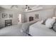 Spacious main bedroom features a tray ceiling, natural light, neutral colors, and carpet at 6070 Lively Ct, Cumming, GA 30040