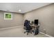 Home office space with a window and a desk with computer setup at 6070 Lively Ct, Cumming, GA 30040