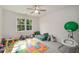Bright playroom with a large window and play area with alphabet carpet at 6070 Lively Ct, Cumming, GA 30040