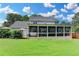 This home boasts a spacious back yard with a screened-in porch, providing a relaxing outdoor living space and a private retreat at 939 Flowers Xing, Lawrenceville, GA 30044