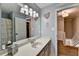 Well-lit bathroom with a spacious vanity, modern fixtures, and charming decor at 939 Flowers Xing, Lawrenceville, GA 30044