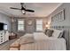 Comfortable bedroom featuring neutral tones, carpet, and natural light through shuttered windows at 939 Flowers Xing, Lawrenceville, GA 30044