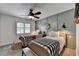 A bedroom featuring two twin beds, modern wall decor and comfortable carpeting at 939 Flowers Xing, Lawrenceville, GA 30044
