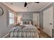 Serene bedroom featuring a metal bed frame, soft textures, and shuttered windows at 939 Flowers Xing, Lawrenceville, GA 30044