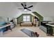 Spacious bonus room or flexible living space with a ceiling fan and natural light at 939 Flowers Xing, Lawrenceville, GA 30044