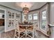 Cozy dining area with natural light, stylish light fixture, and wood flooring, perfect for gatherings at 939 Flowers Xing, Lawrenceville, GA 30044
