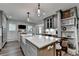 This home features a kitchen island and a view into the living area at 939 Flowers Xing, Lawrenceville, GA 30044
