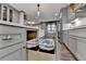 Modern kitchen features ample storage with gray cabinetry and stylish pull-out drawers at 939 Flowers Xing, Lawrenceville, GA 30044