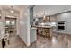 Bright, open kitchen featuring gray cabinets, large island, and modern stainless steel appliances at 939 Flowers Xing, Lawrenceville, GA 30044
