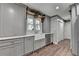 This home features a kitchen with a farm sink and stainless steel appliances at 939 Flowers Xing, Lawrenceville, GA 30044