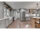 This home features an open kitchen with modern decor and stainless appliances at 939 Flowers Xing, Lawrenceville, GA 30044