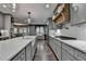 This home features a kitchen with a central island and modern lighting at 939 Flowers Xing, Lawrenceville, GA 30044