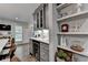 This home features a beverage cooler and open shelving in the kitchen at 939 Flowers Xing, Lawrenceville, GA 30044
