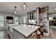 This home features a kitchen island with modern fixtures and decor at 939 Flowers Xing, Lawrenceville, GA 30044