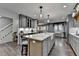 This home features a kitchen with a large island, seating, and open design at 939 Flowers Xing, Lawrenceville, GA 30044