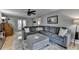 Spacious living room with a large sectional, an ottoman, and a decorative rug on hardwood floors at 939 Flowers Xing, Lawrenceville, GA 30044