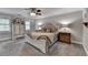Main bedroom features neutral decor, a ceiling fan, and furnishings to match the decor at 939 Flowers Xing, Lawrenceville, GA 30044