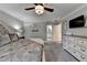 The spacious main bedroom is decorated with neutral colors and includes an en suite bath at 939 Flowers Xing, Lawrenceville, GA 30044